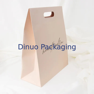 Kledingverpakking Die Cut Handle Winkelen Kraftpapierzak Op maat gemaakte gele geschenkzakken